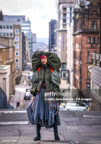 Model Chuwei Ding showcases the designs of fashion student Jiayuan Mao ahead of the Glasgow School of Art Post-Graduate Degree Show 2022 which...