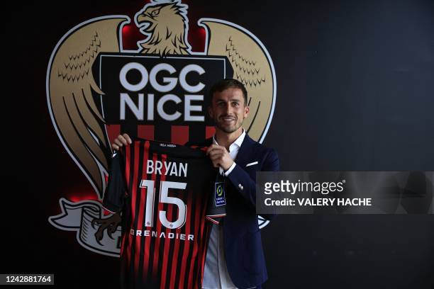 Nice L1 football club newly recruited English defender Joe Bryan poses with his new jersey during his official presentation to the press in Nice,...
