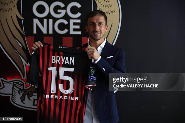 Nice L1 football club newly recruited English defender Joe Bryan poses with his new jersey during his official presentation to the press in Nice,...
