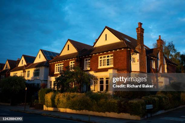 Warm summer sunshine on residential properties, period homes on a south London street in the borough of Lambeth, on 30th August 2022, in London,...