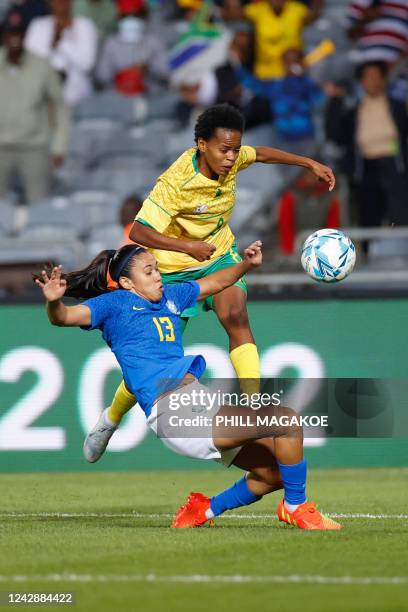 South Africas Hildah Mhlongo is tackled by Brazils Antonia da Costa Silva during the women's international friendly football match between South...