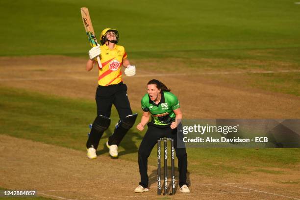 Natalie Sciver of Trent Rockets reacts whilst Tahlia McGrath of Southern Brave celebrates her sides victory at the end of the Hundred Eliminator...