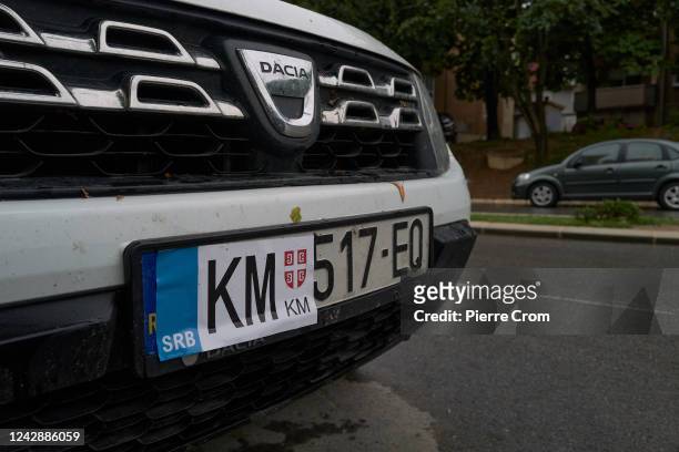 Kosovar vehicle registration plate is covered with a sticker issued by Serbian authorities in North Mitrovica where Kosovo Serbs live on September 2,...