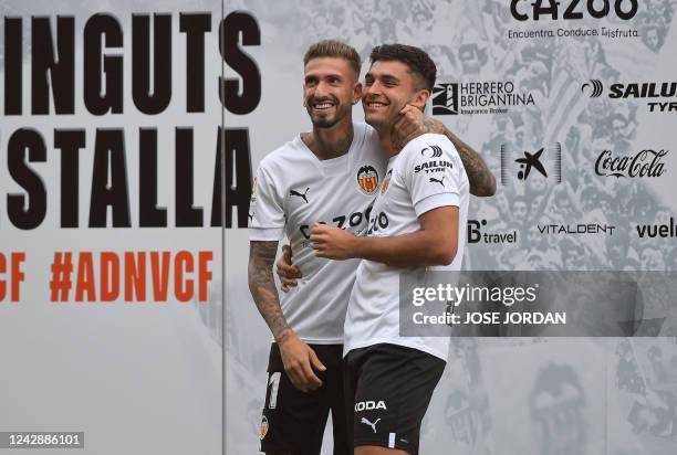 Spanish forwards Samu Castillejo and Hugo Duro pose for a photograph during their official presentation as Valencia CF football club new player at...