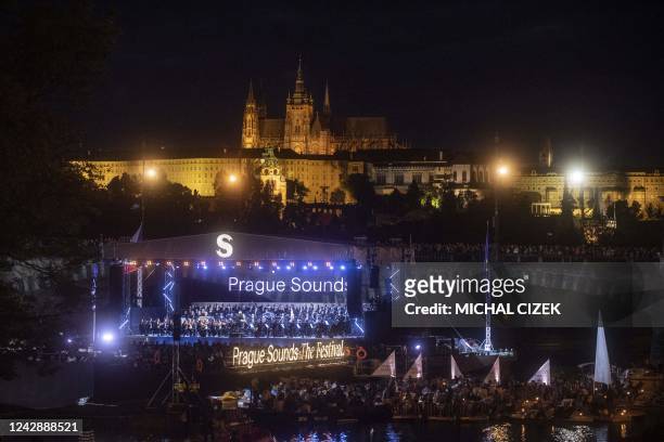Musicians of Czech Philharmonic Orchestra perform on a floating stage on the Vltava River on the occasion of the Czech Presidency of the Council of...