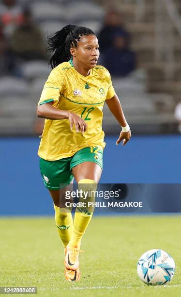 South Africas Jermaine Seoposenwe runs with the ball during the women's international friendly football match between South Africa and Brazil at...