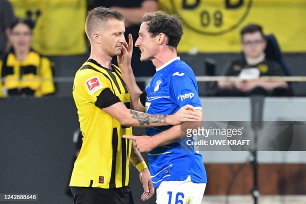 Dortmund's German forward Marco Reus and Hoffenheim's German midfielder Sebastian Rudy have an altercation during the German first division...