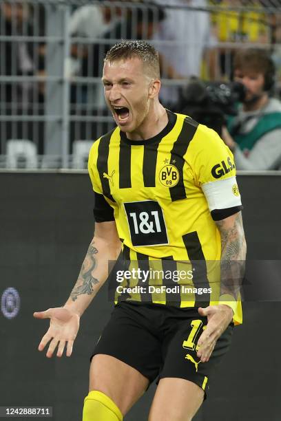 Marco Reus of Borussia Dortmund celebrates after scoring his team's first goal during the Bundesliga match between Borussia Dortmund and TSG...