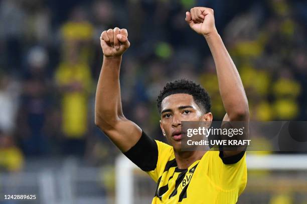 Dortmund's English midfielder Jude Bellingham celebrates after the German first division Bundesliga football match between BVB 09 Borussia Dortmund...