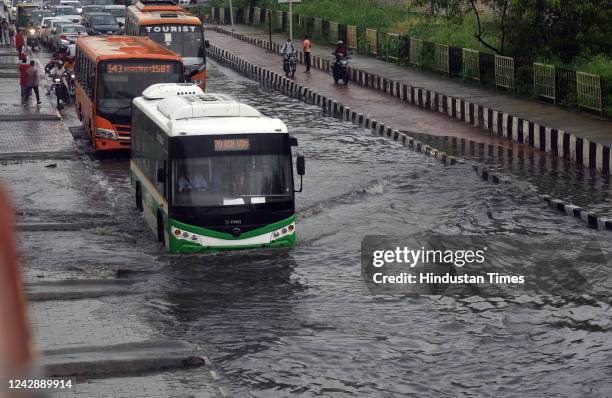 Vehicles wade through a waterlogged stretch on NH-24 near Mayur Vihar, on September 2, 2022 in New Delhi, India. Heavy rains lashed parts of Delhi -...