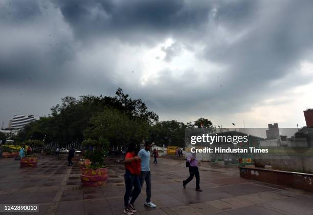 Pedestrian during monsoon rain, at CP on September 2, 2022 in New Delhi, India. Heavy rains lashed parts of Delhi - NCR this afternoon bringing...