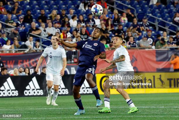 New England Revolution midfielder Lucas Maciel Felix looks to control the ball in front of Chicago Fire FC defensive midfielder Federico Navarro...