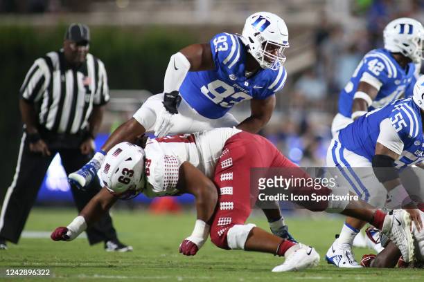 Temple Owls offensive lineman Isaac Moore makes a low block on Duke Blue Devils defensive end Anthony Nelson during the college football game between...