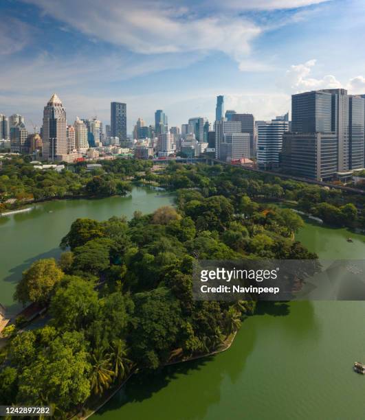 lumpini park surrounded by bangkok cbd buildings, thailand - lumpini park bildbanksfoton och bilder