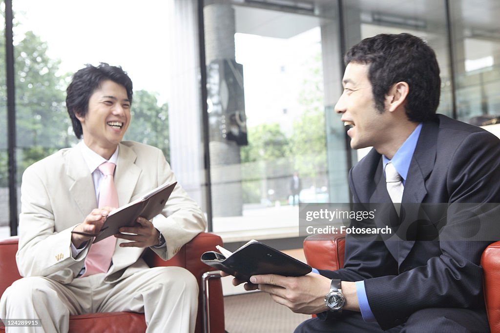 Businessmen having a pleasant chat