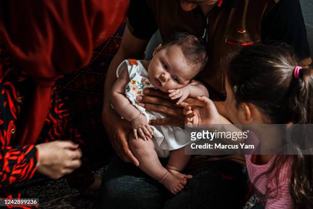 Ali Zafar Mehran, 36 and his wife Karima Mehran along with their daughter Sutooda Mehran and newborn Serena, 1 month old, are Afghan refugees who...