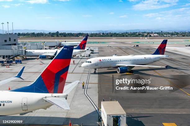 Delta Airlines airplanes prepare for boarding at Los Angeles International Airport on September 02, 2022 in Los Angeles, California.