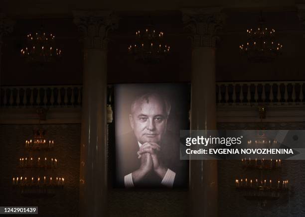 Portrait of Mikhail Gorbachev, the last leader of the Soviet Union, is displayed on the wall during his memorial service at the Column Hall of the...