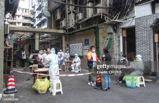 Community residents line up for nucleic acid tests in Chengdu, Sichuan province, China, Sept 3, 2022. The city of Chengdu is temporarily closed...