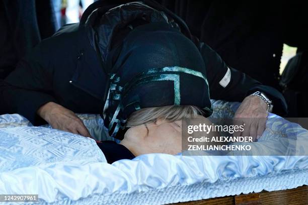 Irina Virganskaya, daughter of Mikhail Gorbachev, the last leader of the Soviet Union, reacts over the coffin during a funeral ceremony at the...