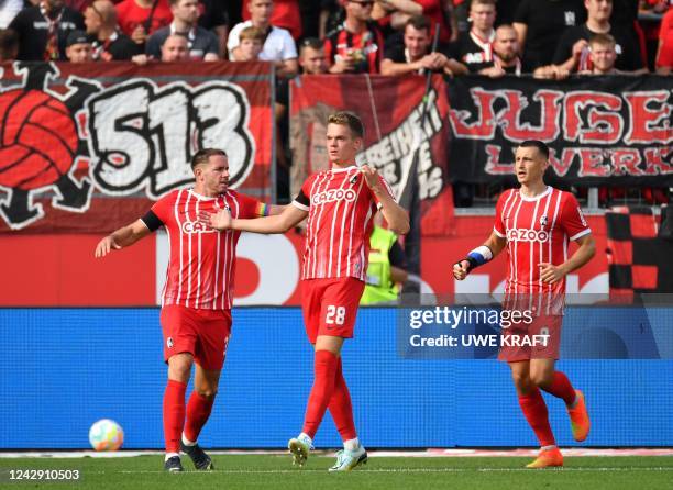 Freiburg's German defender Matthias Ginter celebrates his 1-1 during the German first division Bundesliga football match between Bayer 04 Leverkusen...
