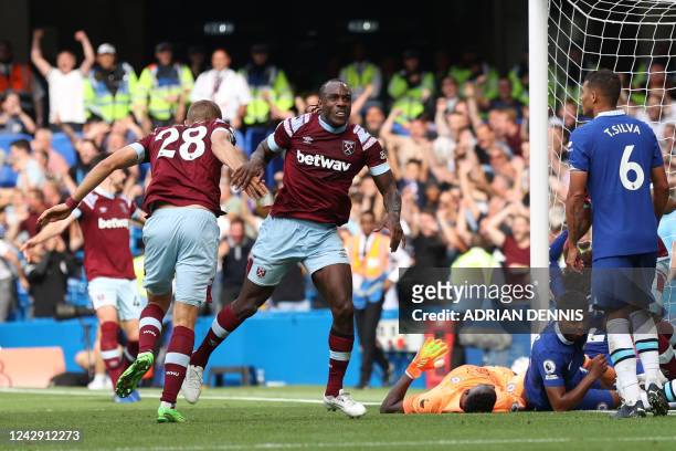 West Ham United's English midfielder Michail Antonio celebrates after scoring his team first goal during the English Premier League football match...