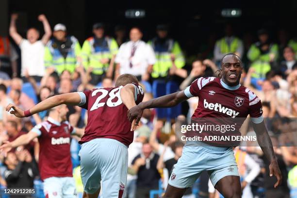 West Ham United's English midfielder Michail Antonio celebrates after scoring his team first goal during the English Premier League football match...