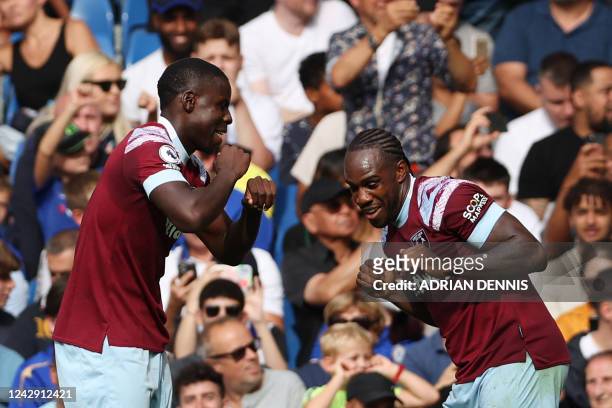 West Ham United's English midfielder Michail Antonio celebrates after scoring his team first goal during the English Premier League football match...