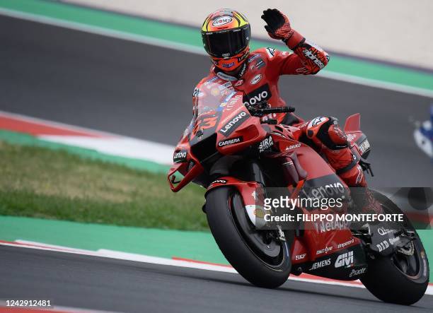 Ducati Lenovo team italian Francesco Bagnaia waves to fans at the end of the last free practice session during the qualifying session of the San...