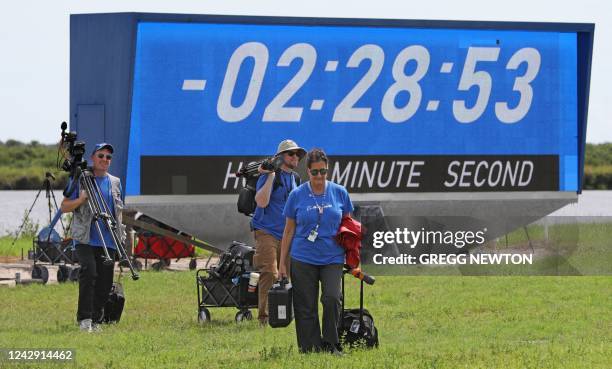 News media leave after the launch of the Artemis 1 rocket was scrubbed at the Kennedy Space Center in Florida on September 3, 2022. - NASA on...