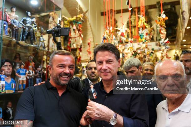 The political leader of the Five Stars Movement, Giuseppe Conte, receives as a gift a statuette from an artisan representing himself during the...