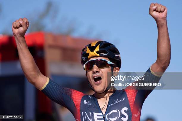 Team Ineos' Ecuadorian rider Richard Carapaz celebrates as he crosses the finish line in first place during the 14th stage of the 2022 La Vuelta...