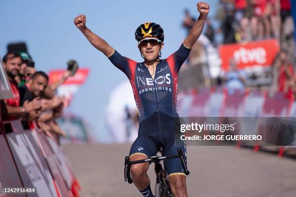 Team Ineos' Ecuadorian rider Richard Carapaz celebrates as he crosses the finish line in first place during the 14th stage of the 2022 La Vuelta...