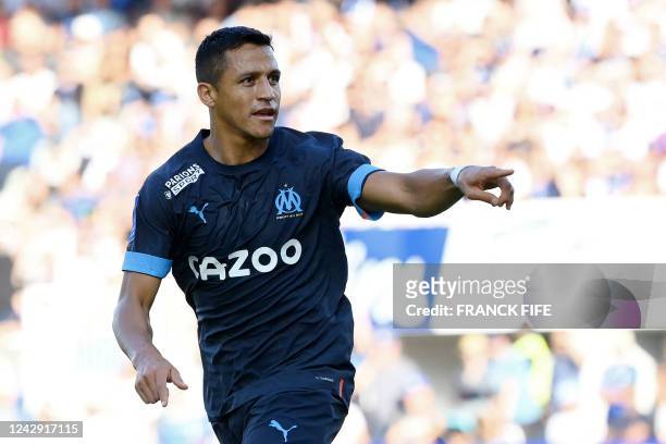 Marseille's Chilean forward Alexis Sanchez celebrates after scoring his team's second goal during the French L1 football match between AJ Auxerre and...