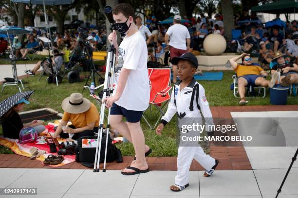 Child wearing an astronaut costume leaves after the launch of the Artemis I unmanned lunar rocket was postponed, in Titusville, Florida, on September...