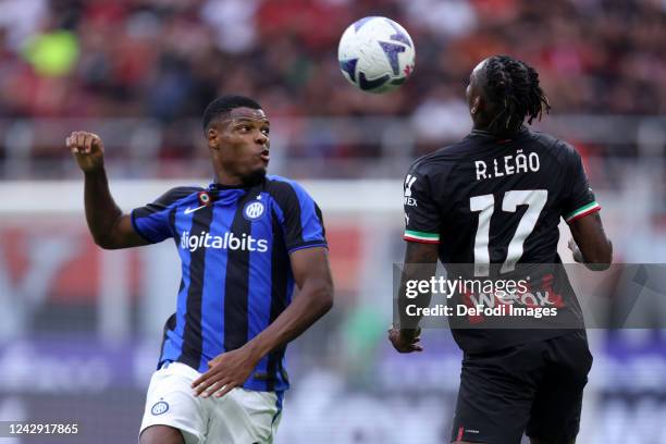 Rafael Leao of AC Milan and Denzel Dumfries of FC Internazionale battle for the ball during the Serie A match between AC Milan and FC Internazionale...