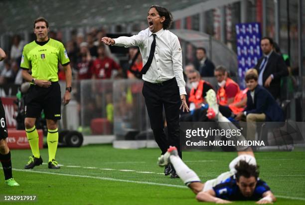 Inter Milan's Italian head coach Simone Inzaghi reacts as Inter Milan's Italian defender Matteo Darmian falls on the pitch during the Italian Serie A...