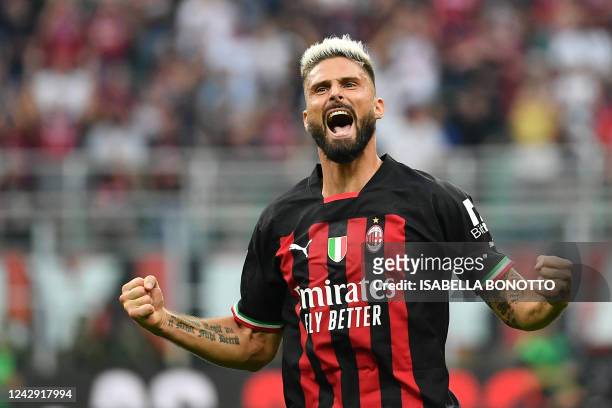 Milan's French forward Olivier Giroud celebrates scoring his team's second goal during the Italian Serie A football match between AC Milan and Inter...