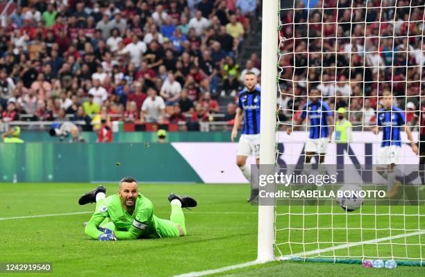 Inter Milan's Slovenian goalkeeper Samir Handanovic concedes a goal during the Italian Serie A football match between AC Milan and Inter Milan at the...