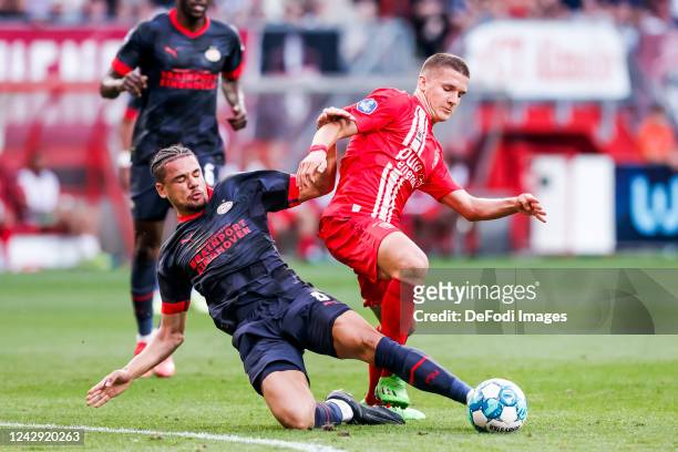 Armando Obispo and Christos Tzolis of FC Twente battle for the ball during the Dutch Eredivisie match between FC Twente and PSV Eindhoven at De...