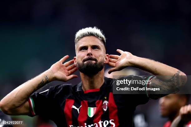 Olivier Giroud of AC Milan celebrate after winning after the Serie A match between AC Milan and FC Internazionale at Stadio Giuseppe Meazza on...