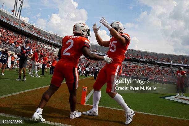 Perris Jones and Grant Misch of the Virginia Cavaliers celebrate a touchdown in the second half of the game against the Richmond Spiders at Scott...