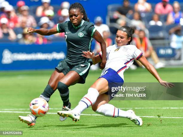 S forward Sophia Smith scores while being guarded by Nigeria's defender Toni Payne during their women's international friendly football match between...