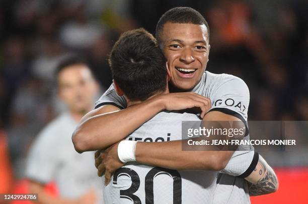 Paris Saint-Germain's French forward Kylian Mbappe celebrates with Paris Saint-Germain's Argentinian forward Lionel Messi after a goal during the...
