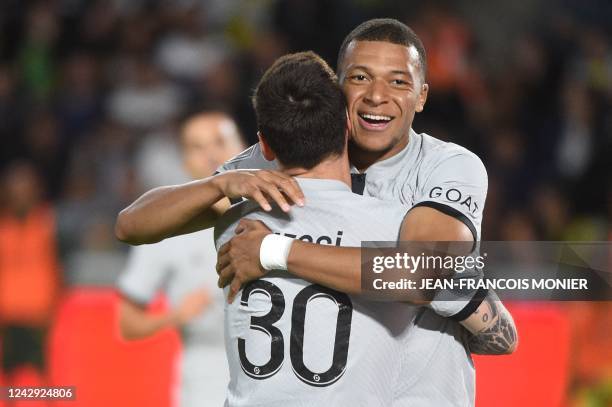 Paris Saint-Germain's French forward Kylian Mbappe celebrates with Paris Saint-Germain's Argentinian forward Lionel Messi after a goal during the...