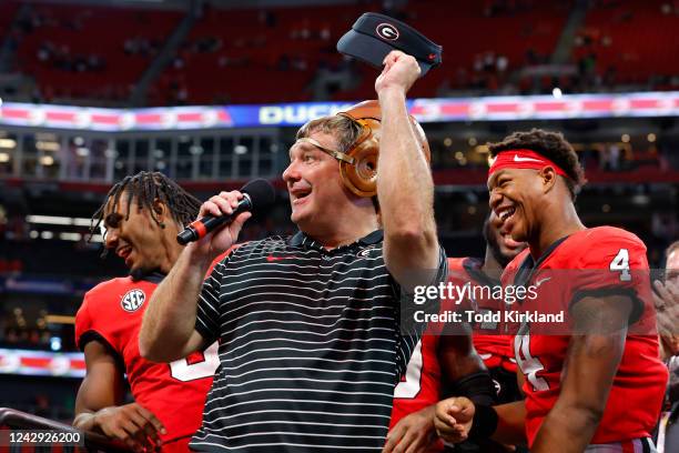 Head coach Kirby Smart of the Georgia Bulldogs speaks to the fans as he wears the Old Leather Helmet after the Bulldogs 49-3 victory over the Oregon...