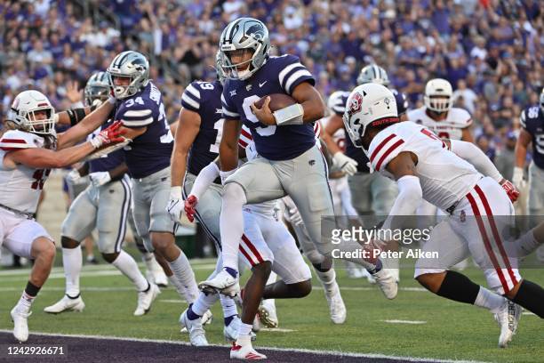 Quarterback Adrian Martinez of the Kansas State Wildcats rushes for a touchdown against the South Dakota Coyotes during the first half at Bill Snyder...