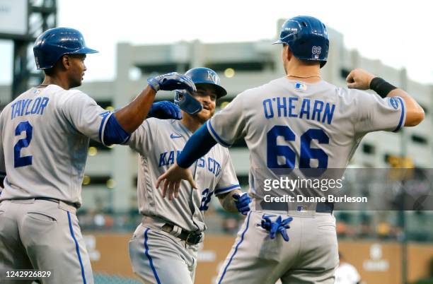Kyle Isbel of the Kansas City Royals celebrates with teammates Michael A. Taylor and Ryan OHearn after hitting a grand slam against the Detroit...