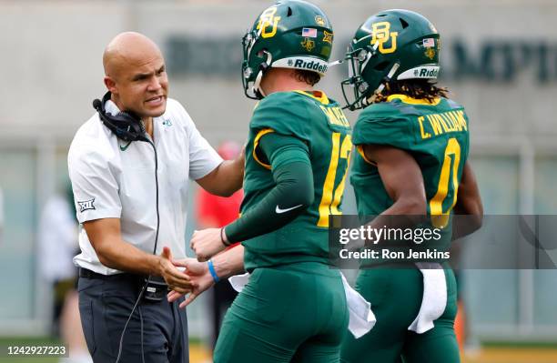 Head coach Dave Aranda of the Baylor Bears welcomes his players to the sidelines after a Baylor touchdown against the Albany Great Danes in the first...