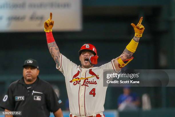 Yadier Molina of the St. Louis Cardinals reacts after hitting a three-RBI double during the third inning against the Chicago Cubs at Busch Stadium on...